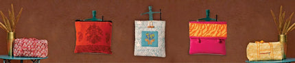 Handcrafted purses and bags with colorful patterns on display, Dhonk Craft collection.