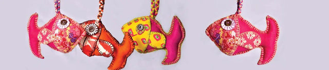 Handcrafted colorful fabric fish toys by Dhonk Craft artisans, ethical home decor.