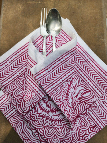 Handcrafted red and white block print cotton napkin folded with spoon and fork, Dhonk Craft