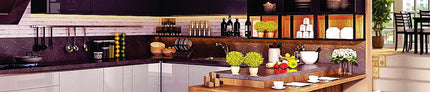 Modern kitchen with handcrafted decor, potted plants, utensils, and countertop accessories.