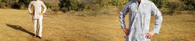 Handcrafted men's cotton kurtas with wildlife motifs, modeled outdoors, Dhonk Craft collection