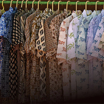 Men's handcrafted organic cotton shirts with artisan prints hanging on a rack, Dhonk Craft