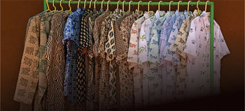 Men's handcrafted organic cotton shirts with artisan prints hanging on a rack, Dhonk Craft