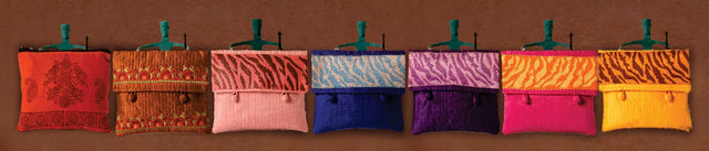Handcrafted cotton purses in vibrant colors with traditional and animal print patterns by Dhonk Craft