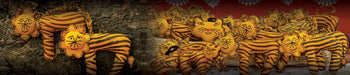 Handcrafted tiger plush toys by Dhonk Craft, featuring yellow and black stripes and artisan detail