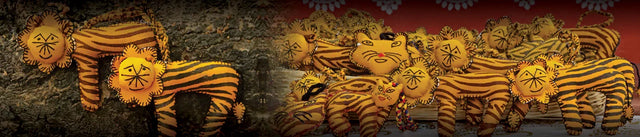 Handcrafted tiger plush toys by Dhonk Craft, featuring yellow and black stripes and artisan detail