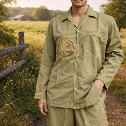 Man wearing olive green handcrafted cotton shirt and pants by Dhonk Craft outdoors