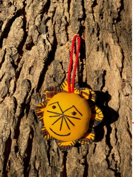 Handcrafted lion ornament by Ranthambore artisans on tree bark, ethical Dhonk Craft decor