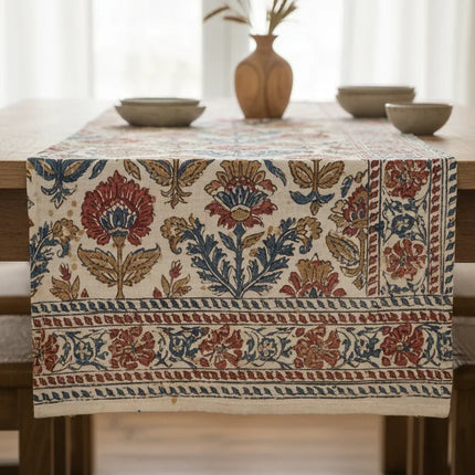 Handblock printed cotton table runner with floral design on a wooden dining table, Dhonk Craft