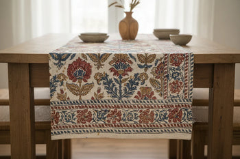 Cotton handblock printed table runner with floral patterns on wooden dining table