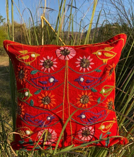 Handcrafted red embroidered cushion with colorful birds and floral designs by Dhonk Craft