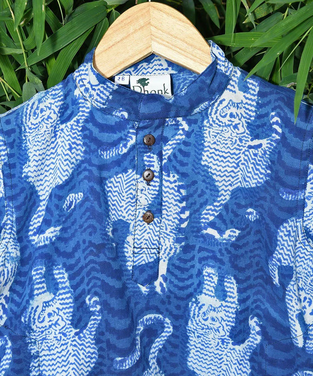 Handcrafted blue indigo cotton kurta with tiger print by Dhonk Craft, sustainable fashion.