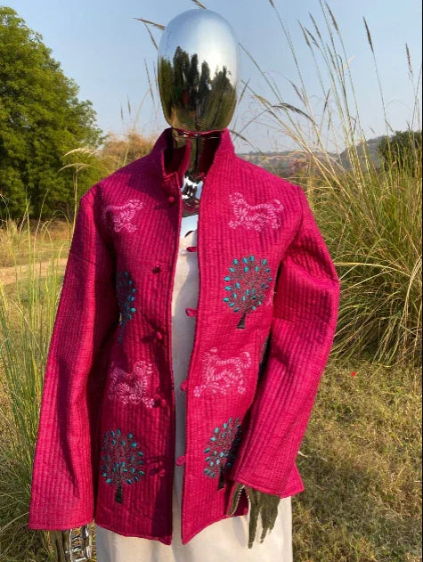 Handcrafted magenta cotton jacket with tree and animal embroidery, displayed outdoors by Dhonk Craft