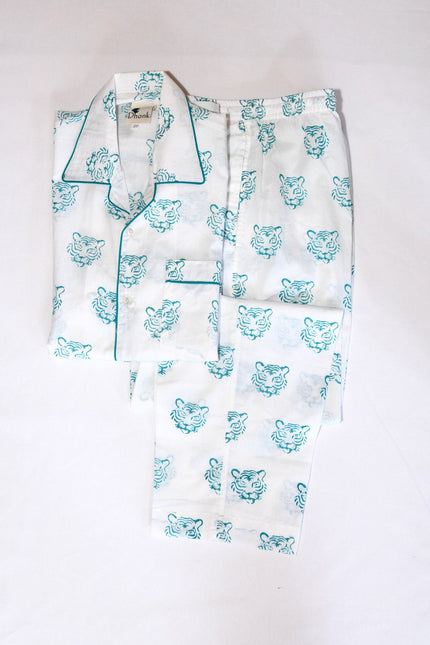 A pyjama set with hand block print design in blue and white colors, consisting of a shirt with a round neckline and a single pocket, and matching pants with an adjustable drawstring.
