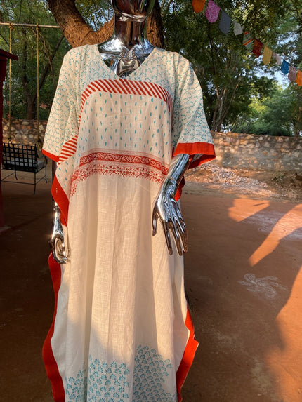 Woman wearing white and pink floral cotton kaftan