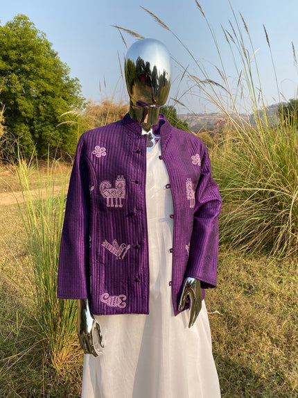 purple handcrafted embroidered jacket for women worn over white dress.