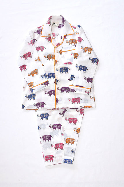 A set of infant's pajamas with a block print pattern featuring various animals in multiple colors on a light background.