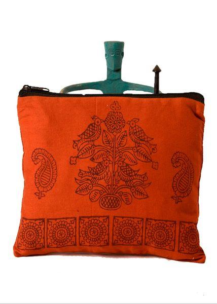 An orange cotton zipper pouch with a floral hand block print design