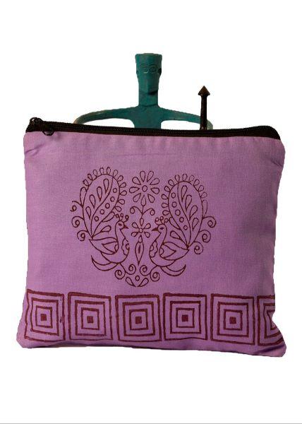 A purple cotton zipper pouch with hand block print design