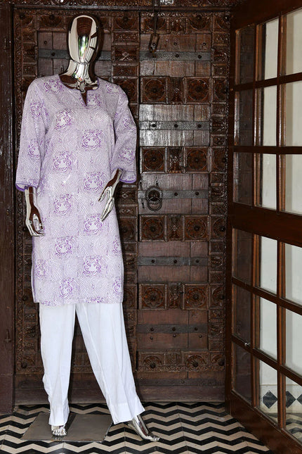 Handcrafted purple printed cotton kurta and white pants on mannequin, wooden ethnic door backdrop